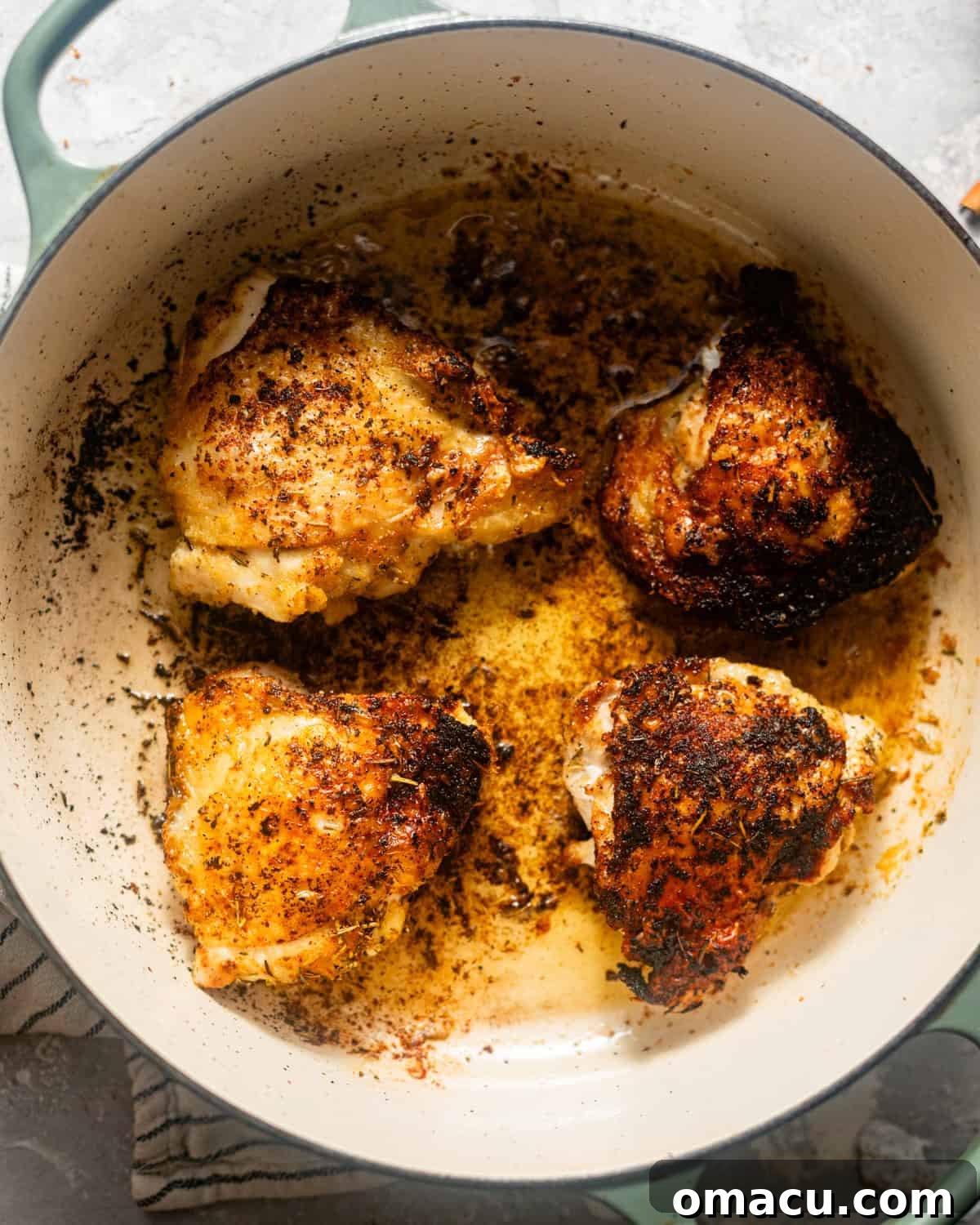 seared chicken thighs in a large pot. 