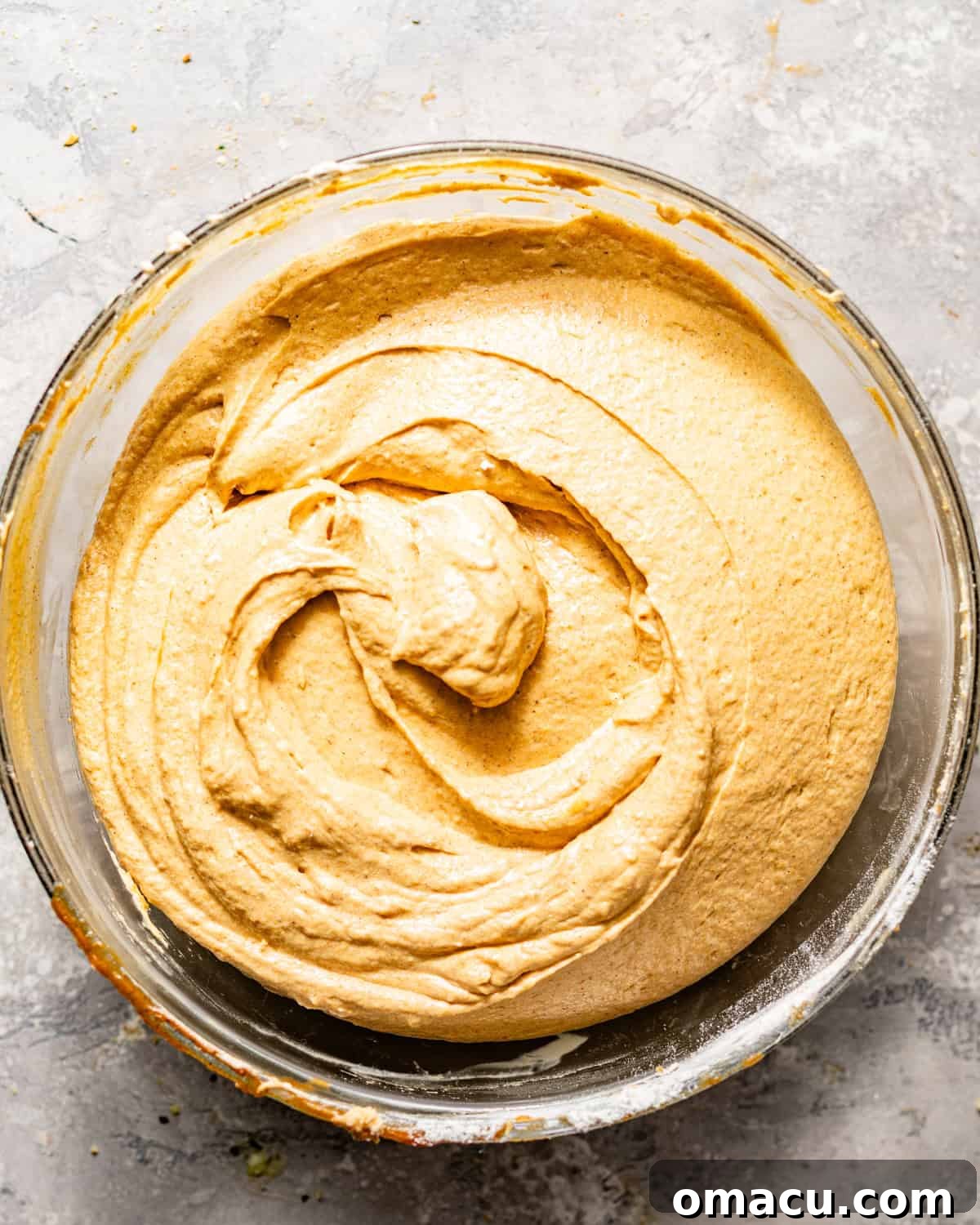 The smooth, thick pumpkin pound cake batter resting in a large mixing bowl, ready for the bundt pan.