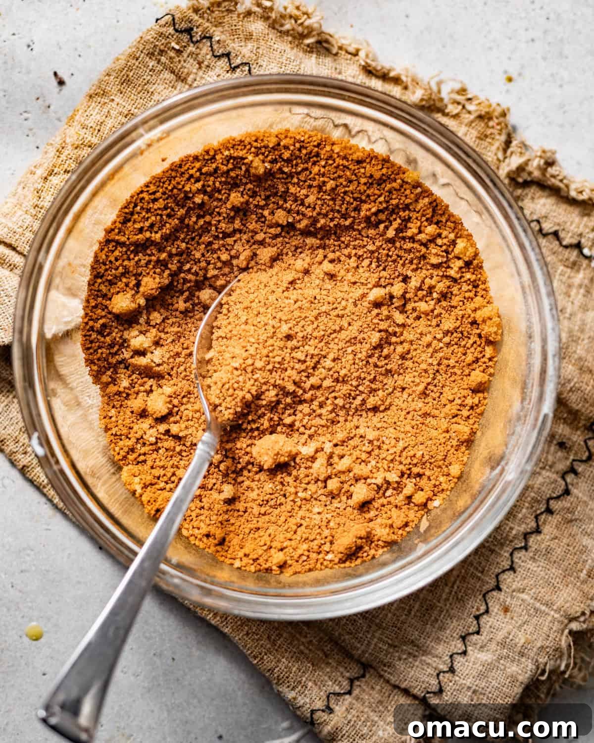 A small bowl containing a perfectly mixed cinnamon sugar filling, ready for layering within the coffee cake for that signature swirl.