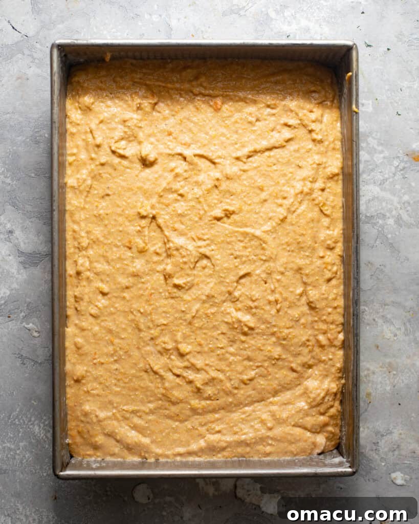 half of the pumpkin batter in a baking pan before adding the streusel topping and cinnamon sugar on top. 