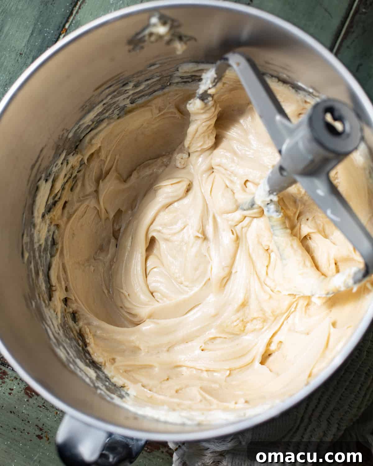 cream cheese, pumpkin pie spice, sugar, brown sugar, molasses, and cornstarch mixed together in the bowl of a stand mixer.