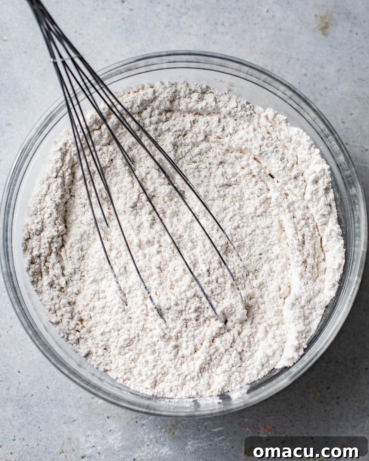 Dry ingredients for brown sugar pound cake whisked together in a bowl.