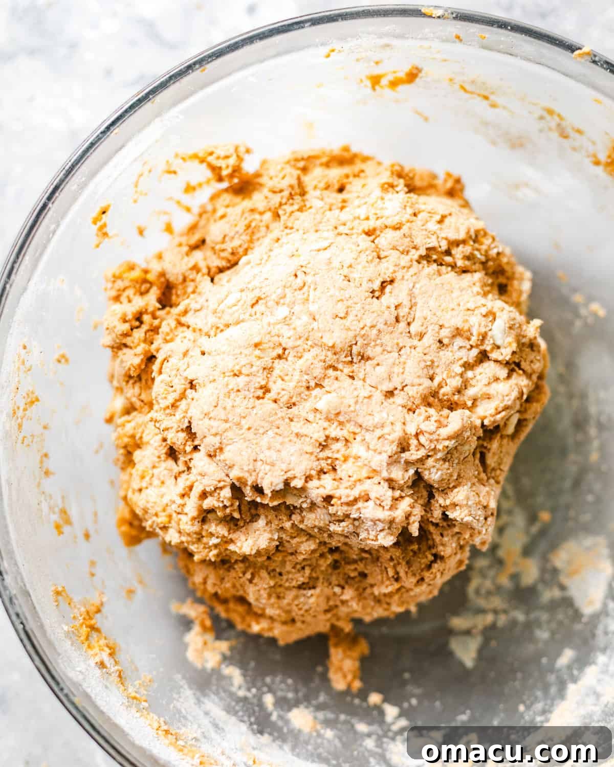 Sweet potato biscuit dough in a mixing bowl, ready for shaping.