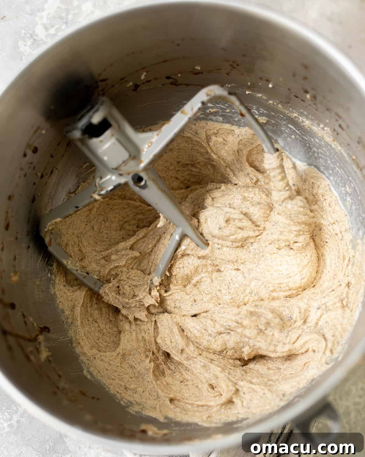 Creamed browned butter, brown sugar, and granulated sugar in the bowl of a stand mixer.