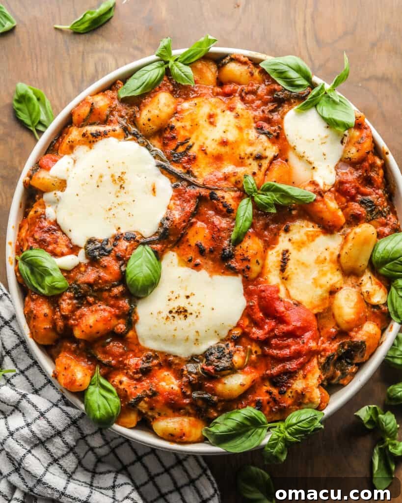 Ingredients for Sausage and Spinach Gnocchi Bake laid out on a kitchen counter