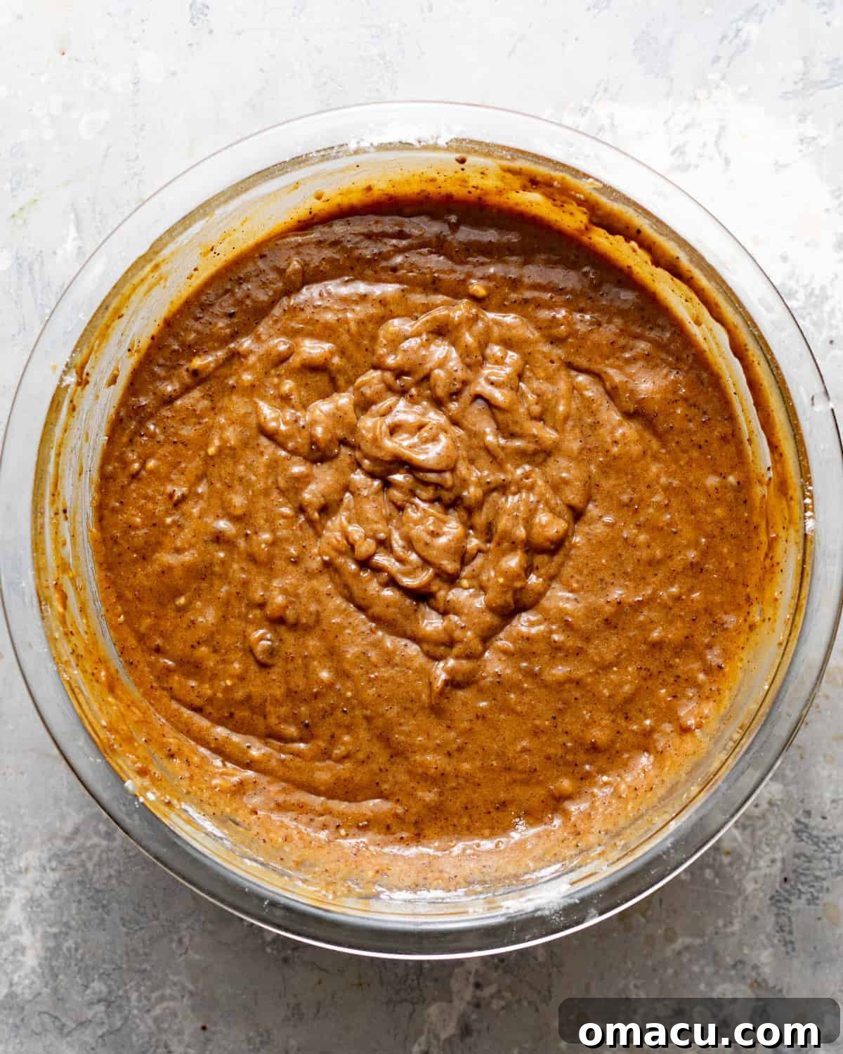 Sticky toffee pudding cake batter in a mixing bowl.