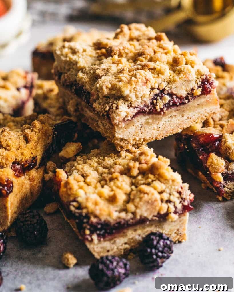Brown Butter Mixed Berry Crumble Bars cooling on a wire rack.