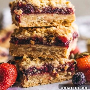 mixed Berry Crumble Bars stacked on top of each other
