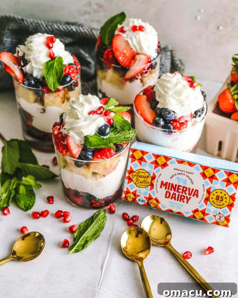 Product shot of Minerva Dairy butter next to fresh mixed berries, emphasizing high-quality ingredients for the trifle recipe.