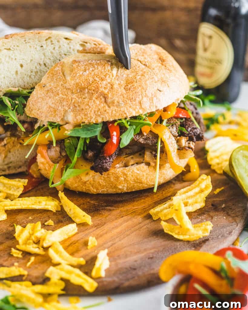 Delicious Cajun steak sandwich served on a cutting board with a side of crispy chips and tangy pickles, capturing the vibrant flavors of New Orleans.