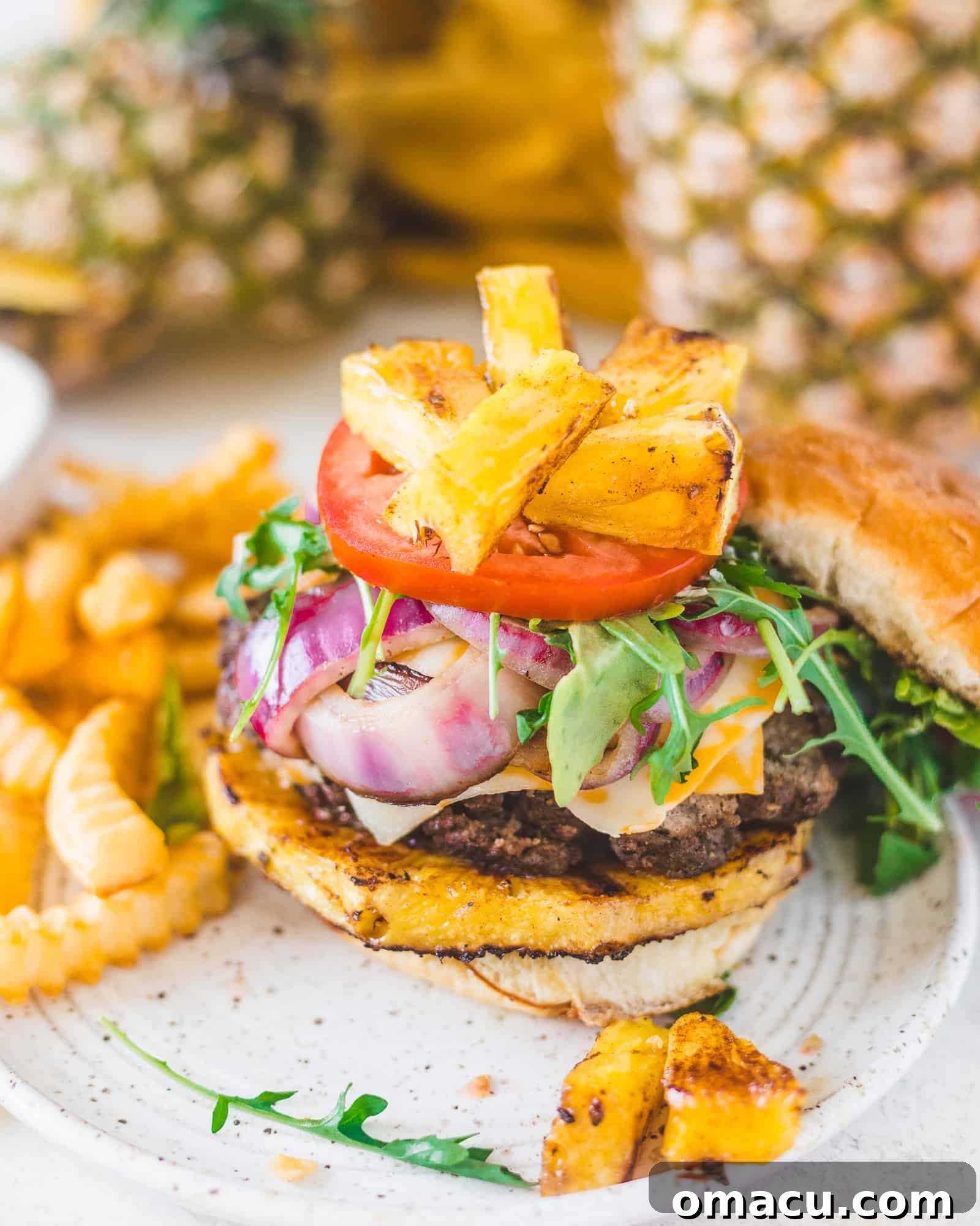 The fully assembled Jamaican Jerk Burger, ready to be enjoyed, showcasing all its delicious layers.