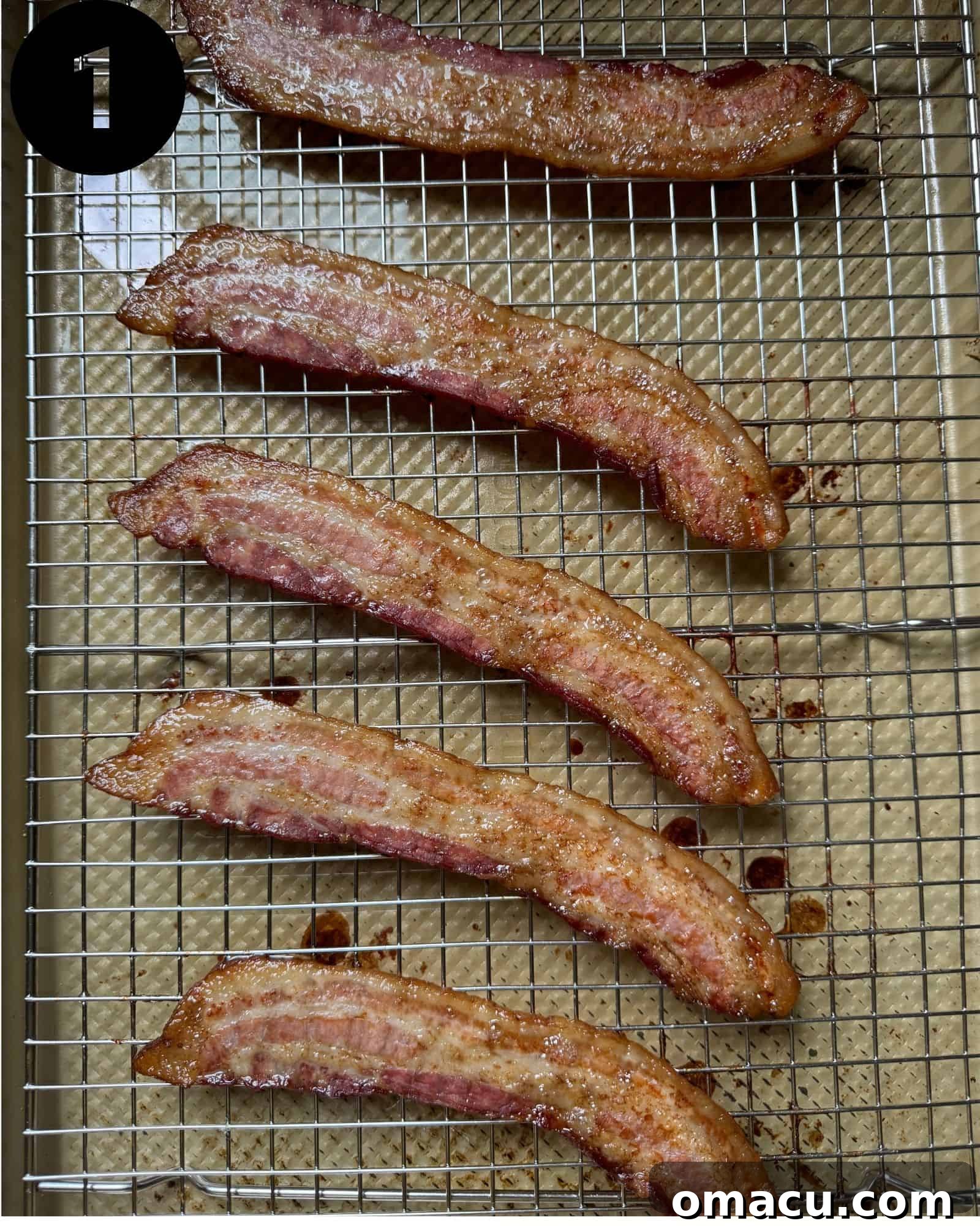 Crispy cooked bacon cooling on a wire rack.