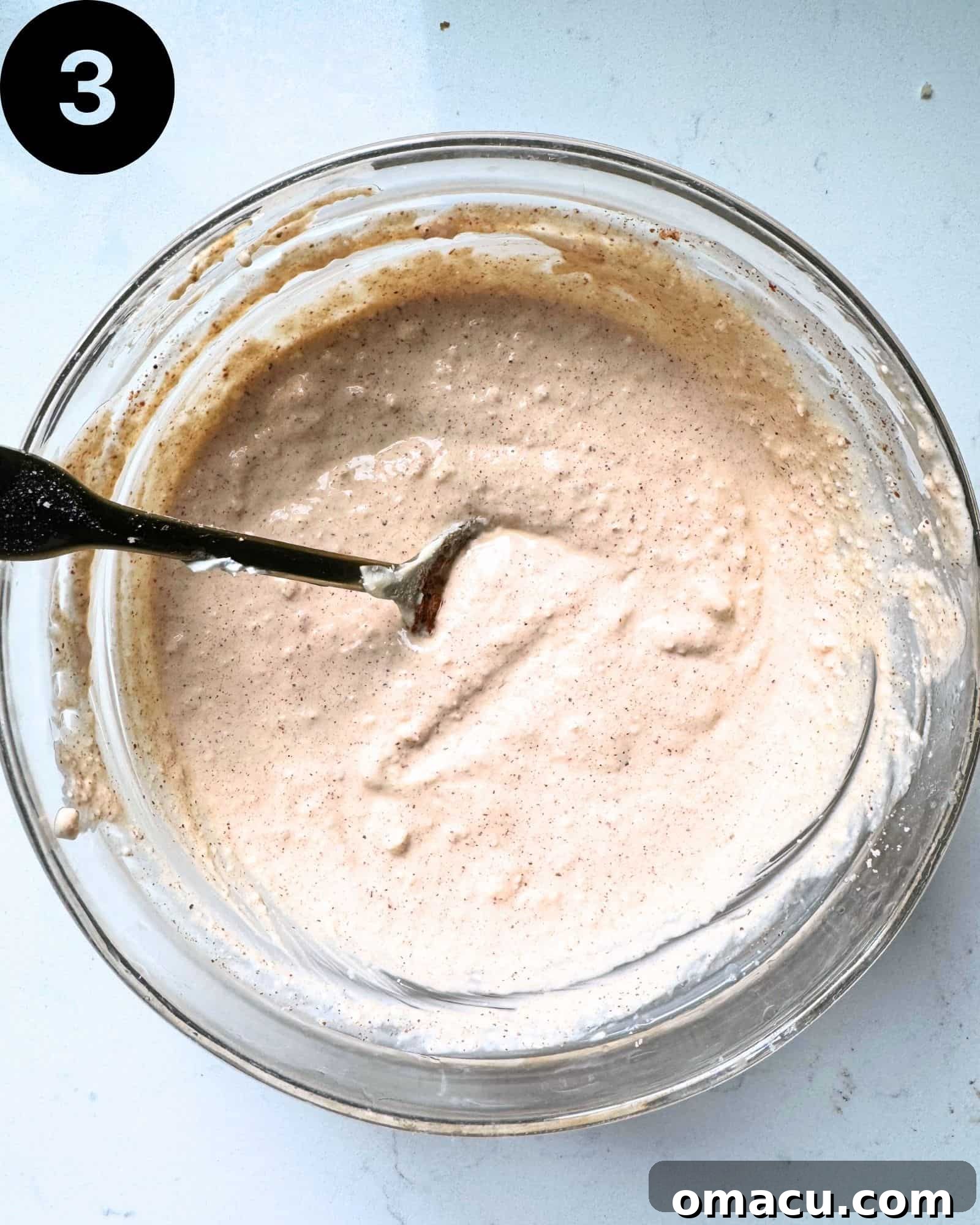 All the dressing ingredients mixed smoothly in a bowl.