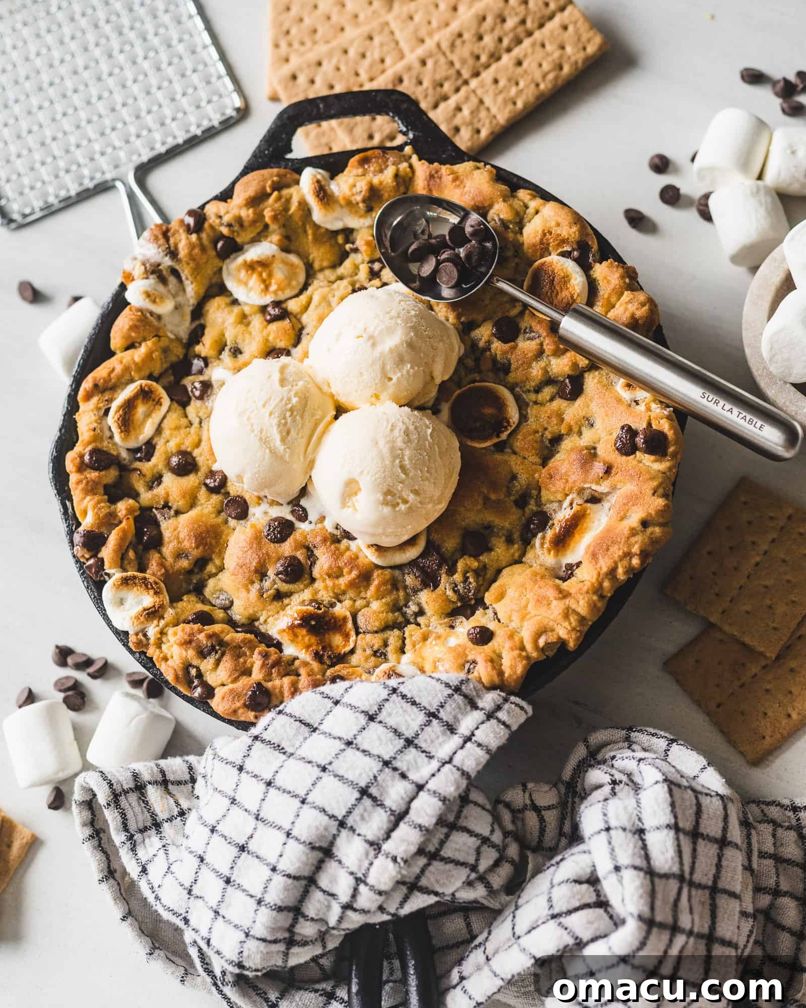 Empty cast iron skillet, implying the delicious cookie has been enjoyed.