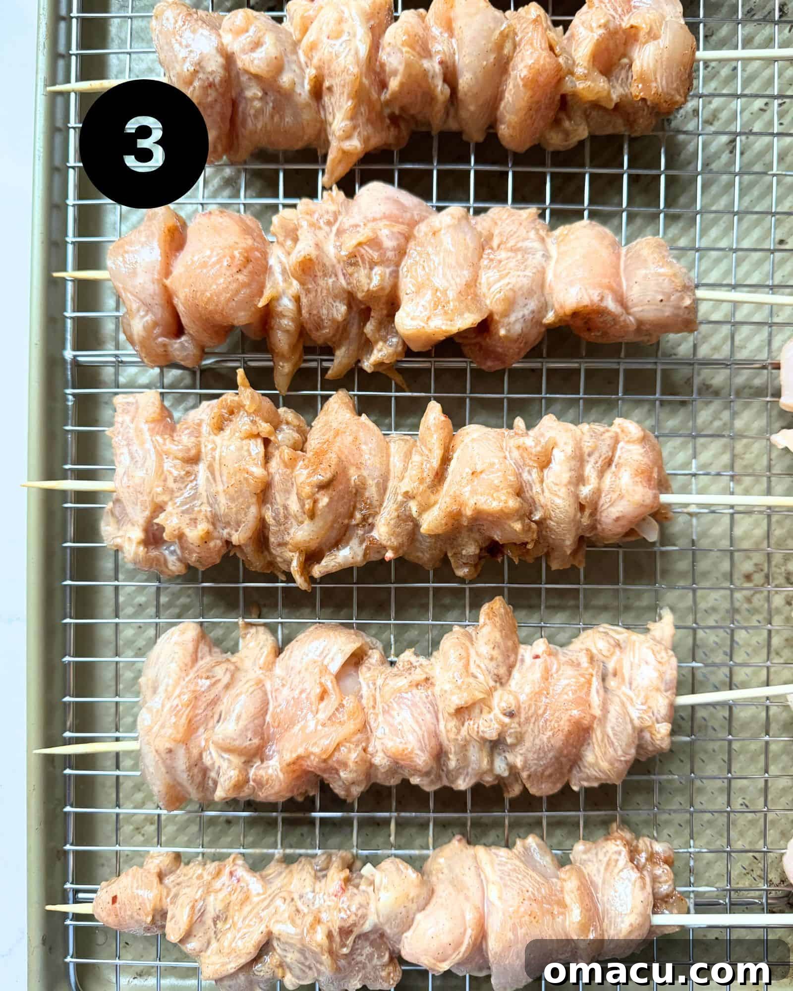 Bang Bang Chicken Skewers on a baking sheet.