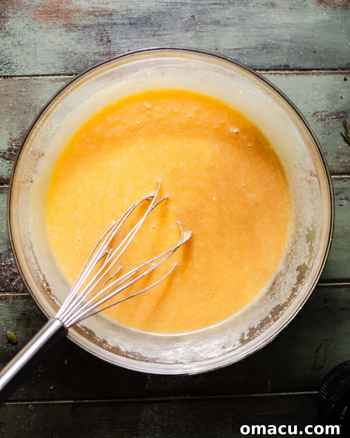Wet ingredients whisked together in a bowl.