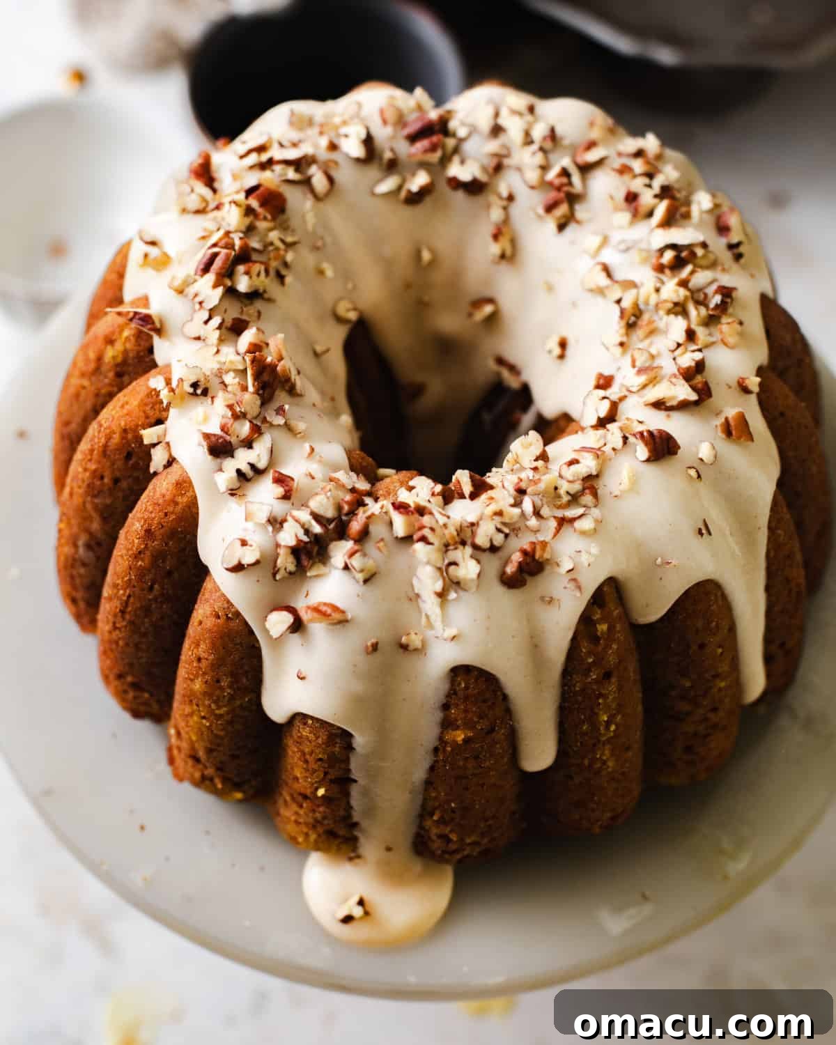 Overhead photo of carrot bundt cake on a cake stand.