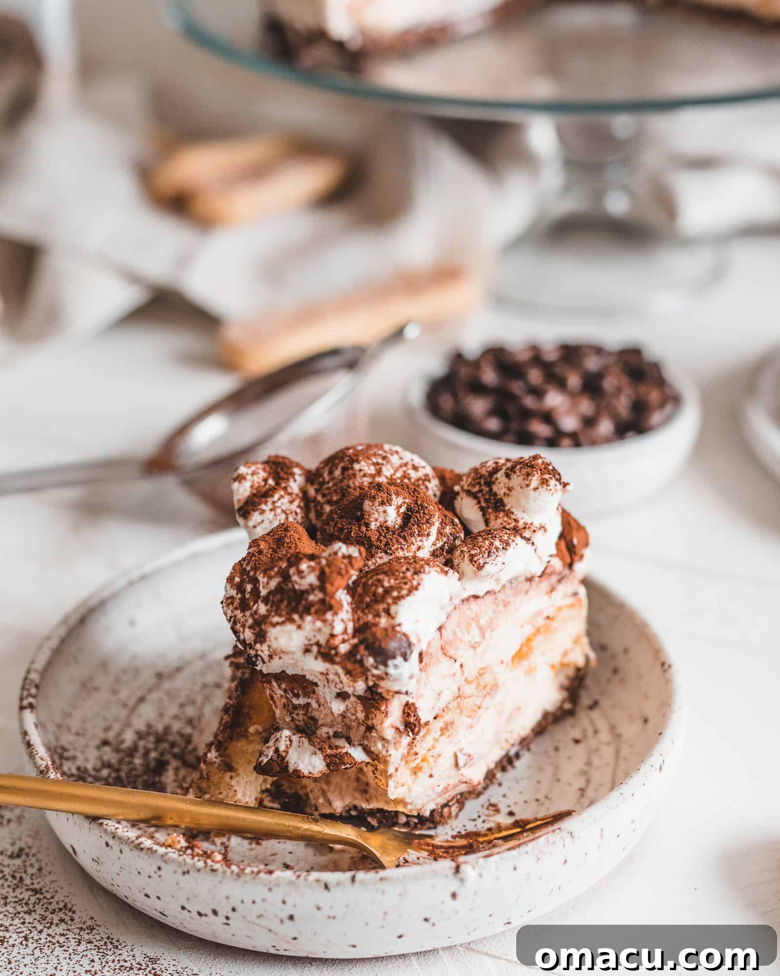 A close-up view capturing the rich, textured layers of a No-Bake Tiramisu Cheesecake, highlighting its inviting appeal.