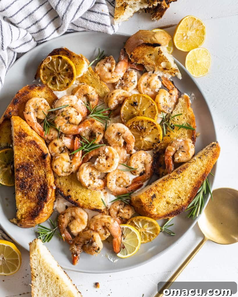 Overhead photo of shrimp and toast on a plate with whipped feta
