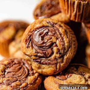 Stacked banana Nutella muffins, showcasing their rich texture and tempting appearance.