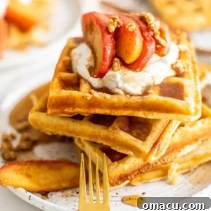 Close up shot of brown butter waffles with cinnamon apples