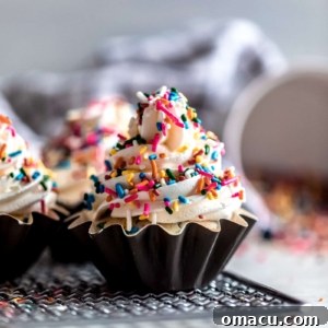 Funfetti Cupcakes with Almond Buttercream with sprinkles on top, a delicious homemade dessert.