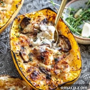 Spaghetti Squash on a tray with fresh herbs in the background