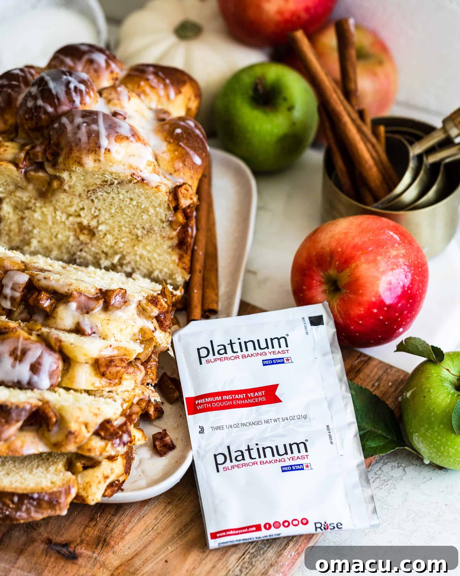Red Star Yeast package positioned with a freshly baked loaf of bread in the background, highlighting key ingredients