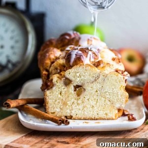 Apple and Pear Bread with whisk drizzling glaze on top
