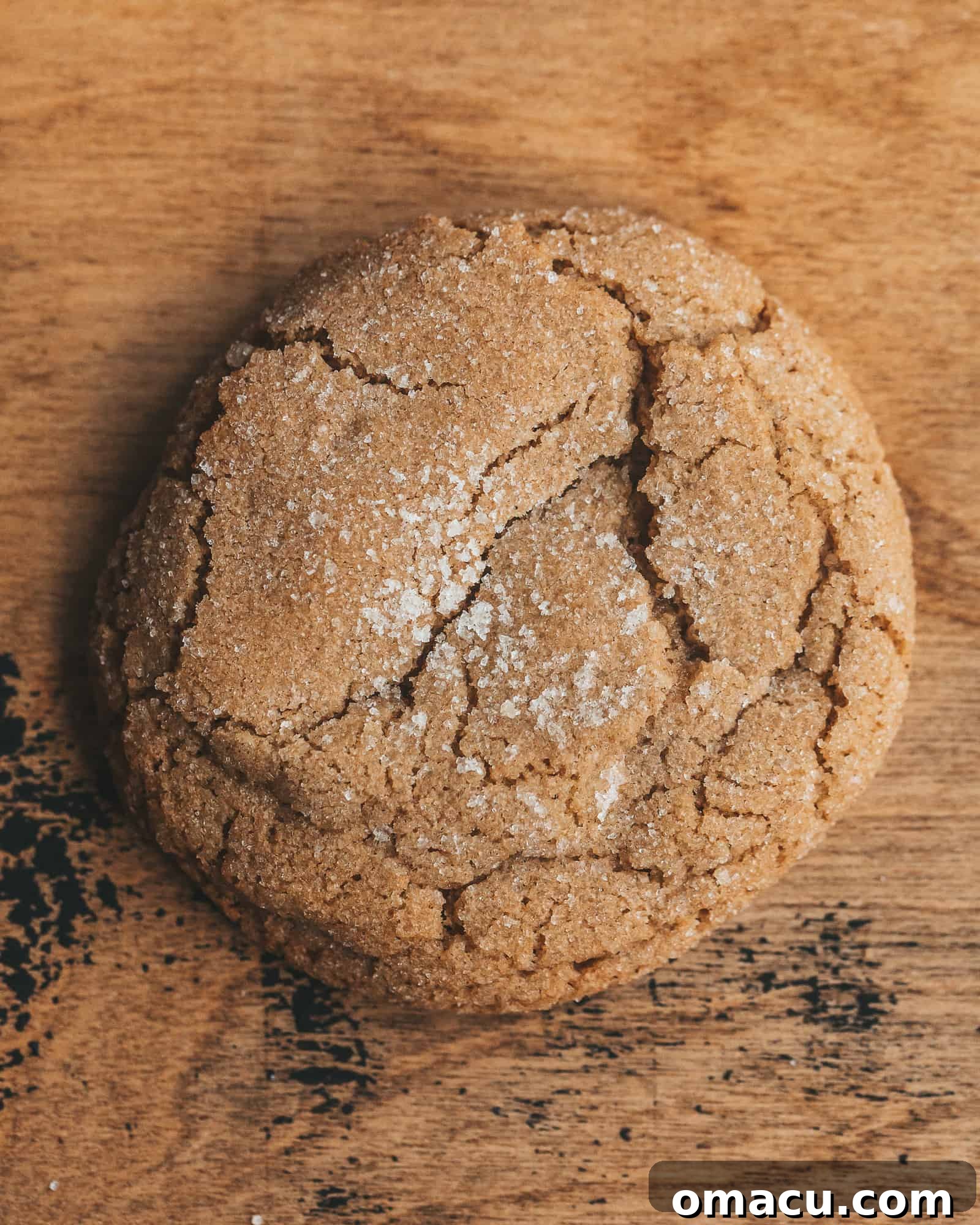 Brown Butter Chai Cookies arranged artfully on a rustic wooden surface, highlighting their texture