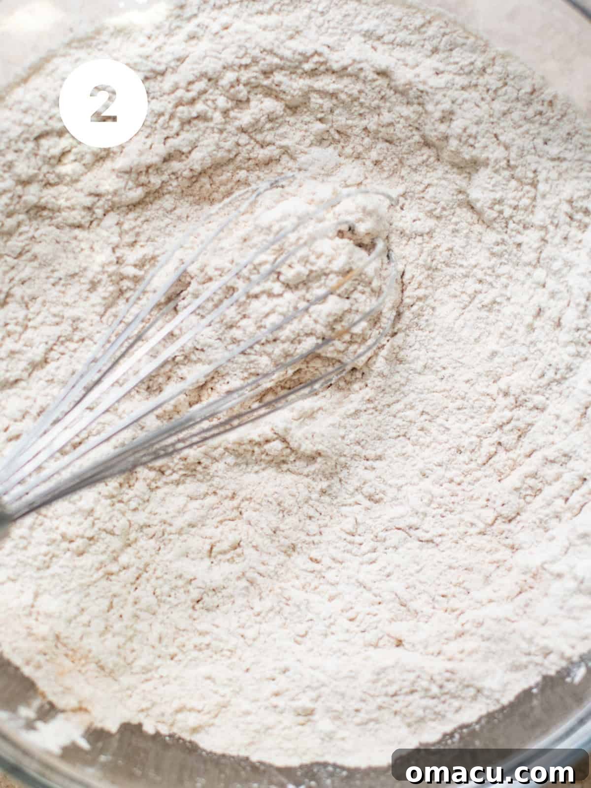 Dry ingredients - flour, cinnamon, cloves, ginger, salt, baking soda, and nutmeg thoroughly whisked together in a bowl.