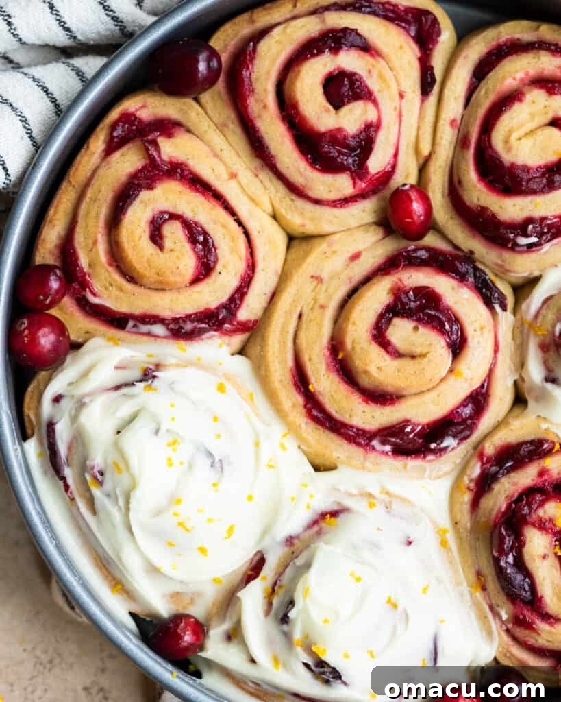 The finished platter of cranberry cinnamon rolls, still warm, waiting for their final touch of glaze.