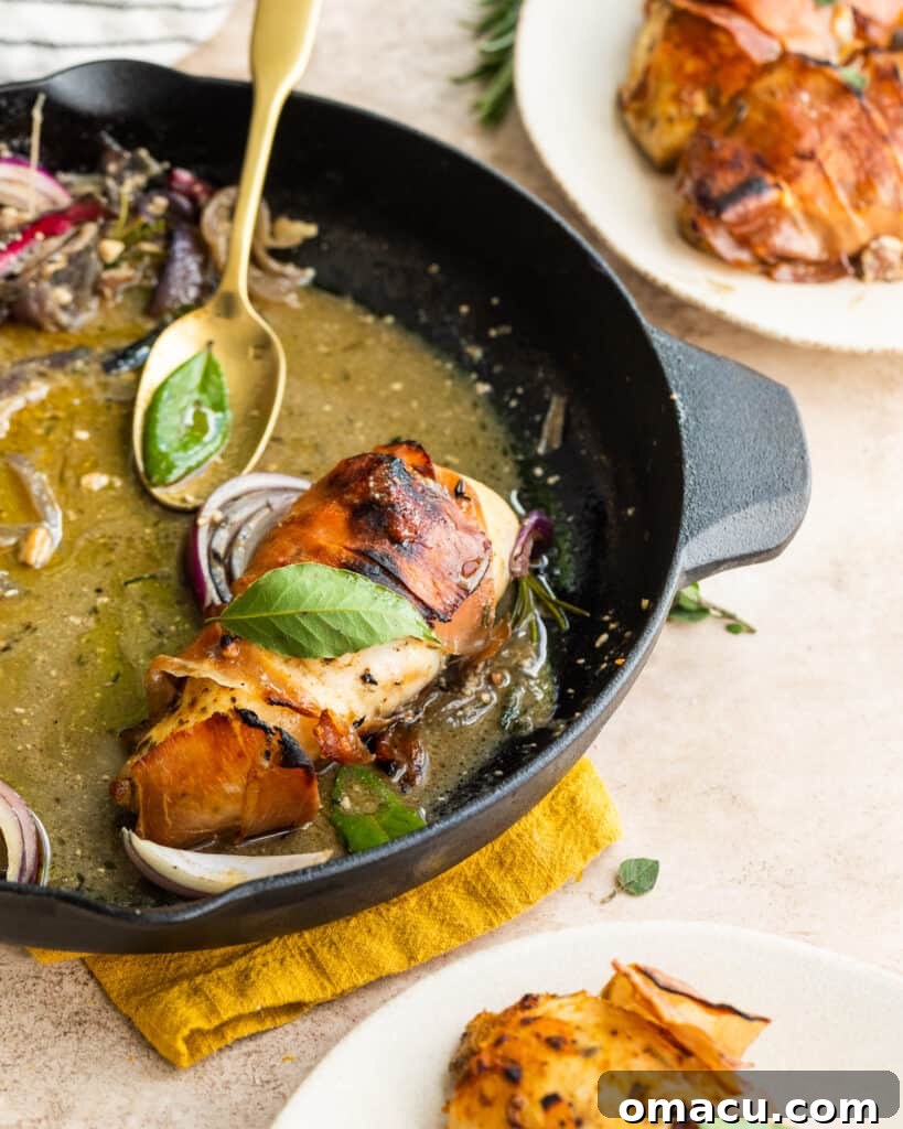 A serving of prosciutto wrapped chicken with fig glaze on a plate, ready to be enjoyed