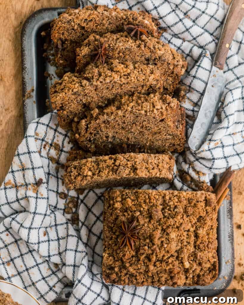 Overhead shot of a full maple cinnamon banana bread loaf on a serving tray, perfect for sharing