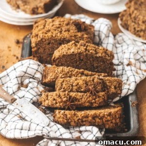 sliced loaf on a serving tray with coffee cups in the background