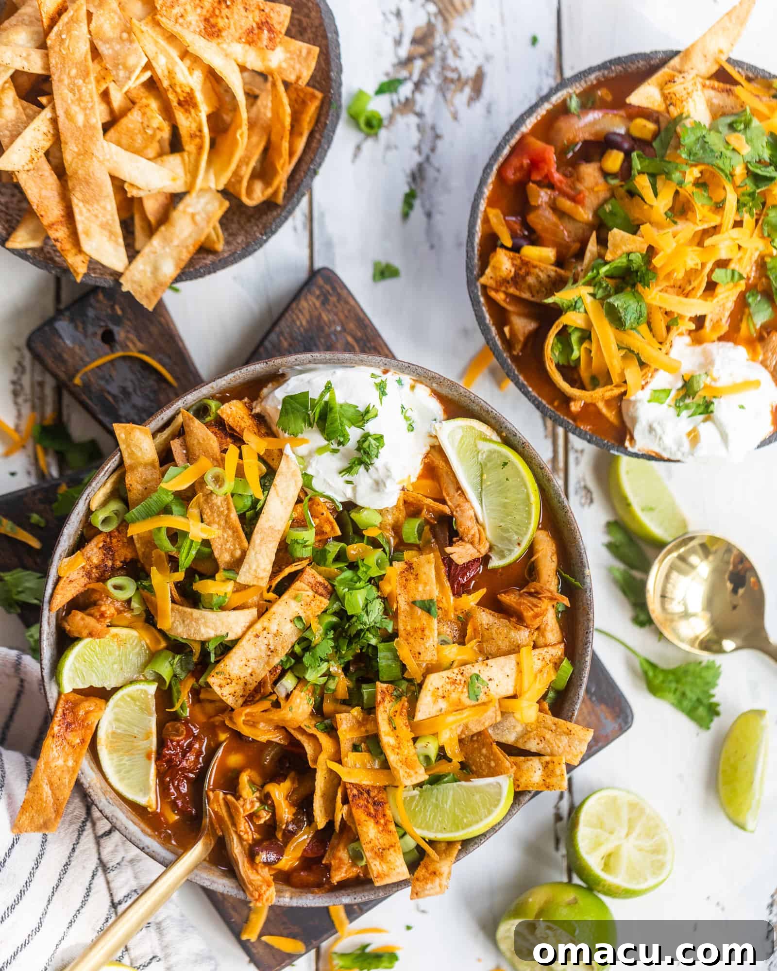 two bowls of soup with fried tortilla chips