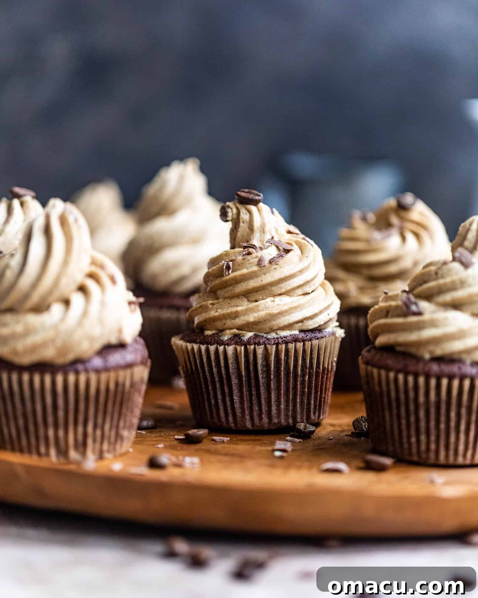 cupcakes with espresso buttercream on a wooden plate, ready to be served