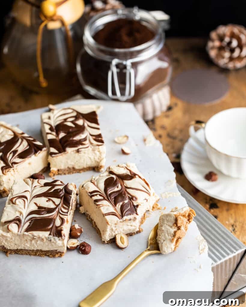 Mocha peanut butter cheesecake bars expertly cut and arranged on a baking pan with a spoon, highlighting resourcefulness in food styling.