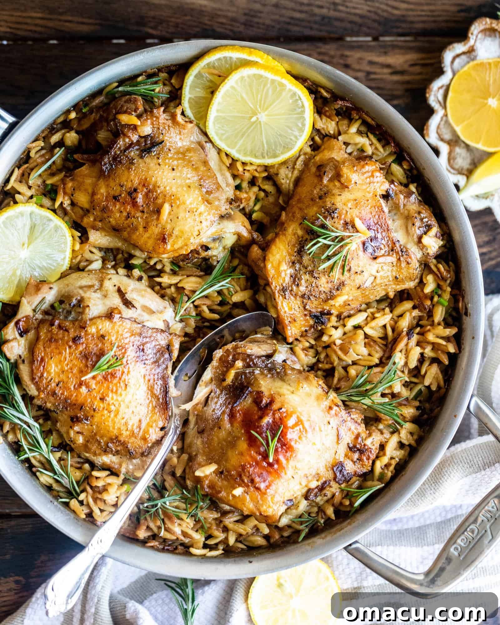 rosemary chicken with parmesan orzo in a pan
