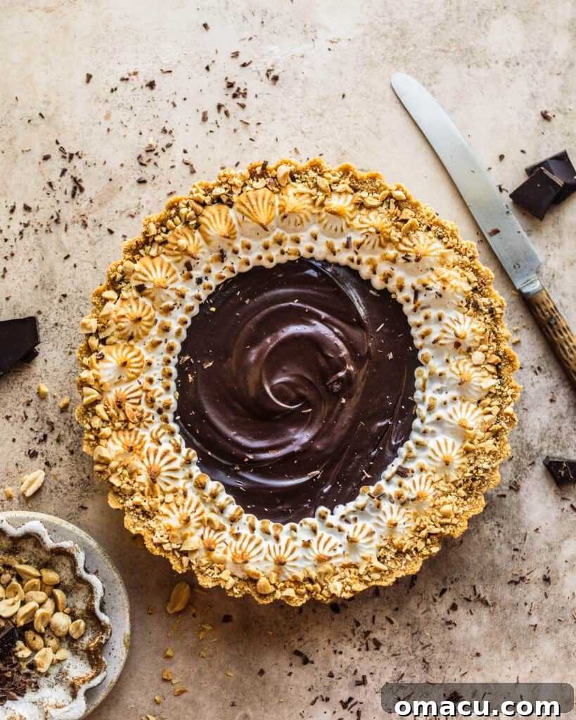 Decadent Chocolate Salted Caramel Tart on a rustic wooden table, ready to be sliced and enjoyed.