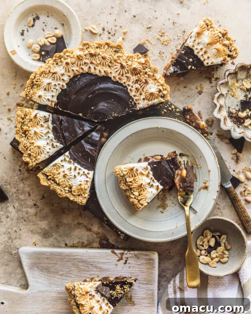 A beautifully presented sliced chocolate tart on a serving board, with individual slices arranged on a plate nearby, ready for guests.