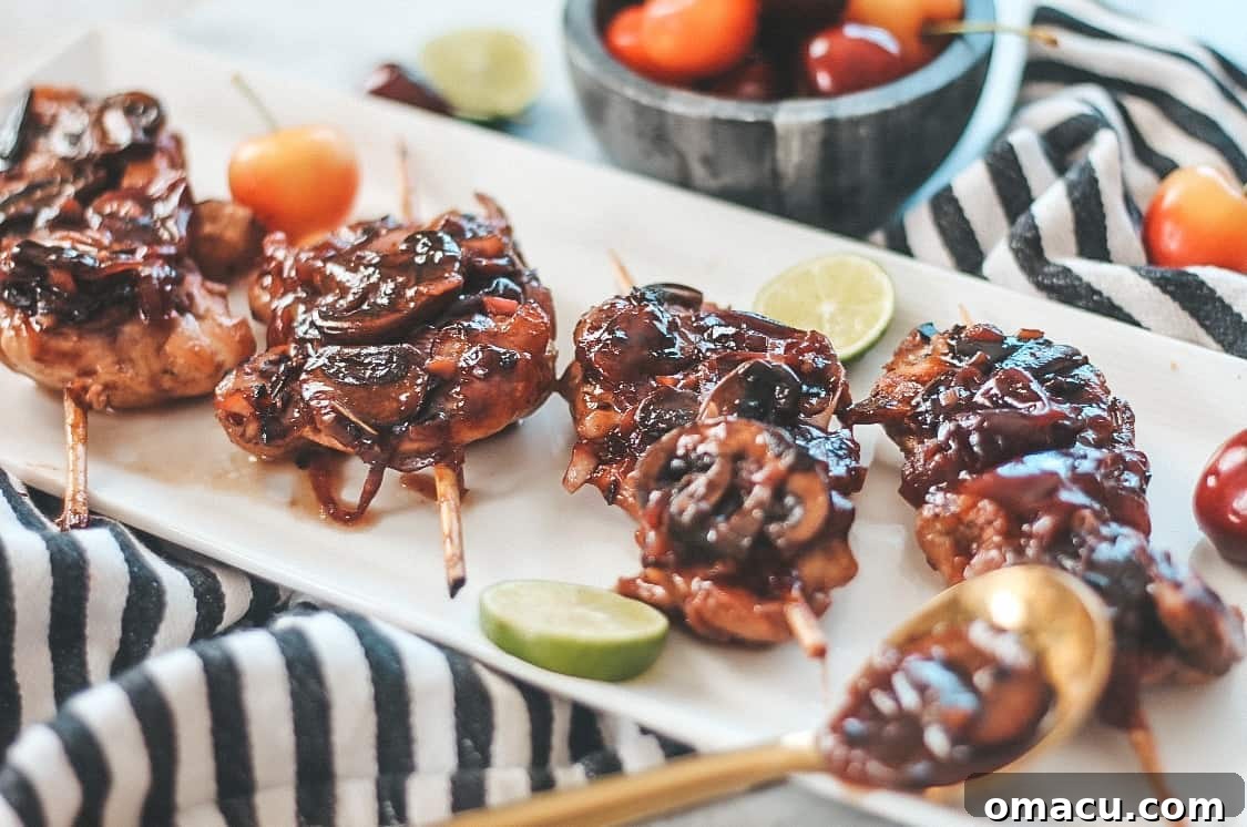 Close-up of Cherry Balsamic Chicken Skewers with vibrant cherry glaze
