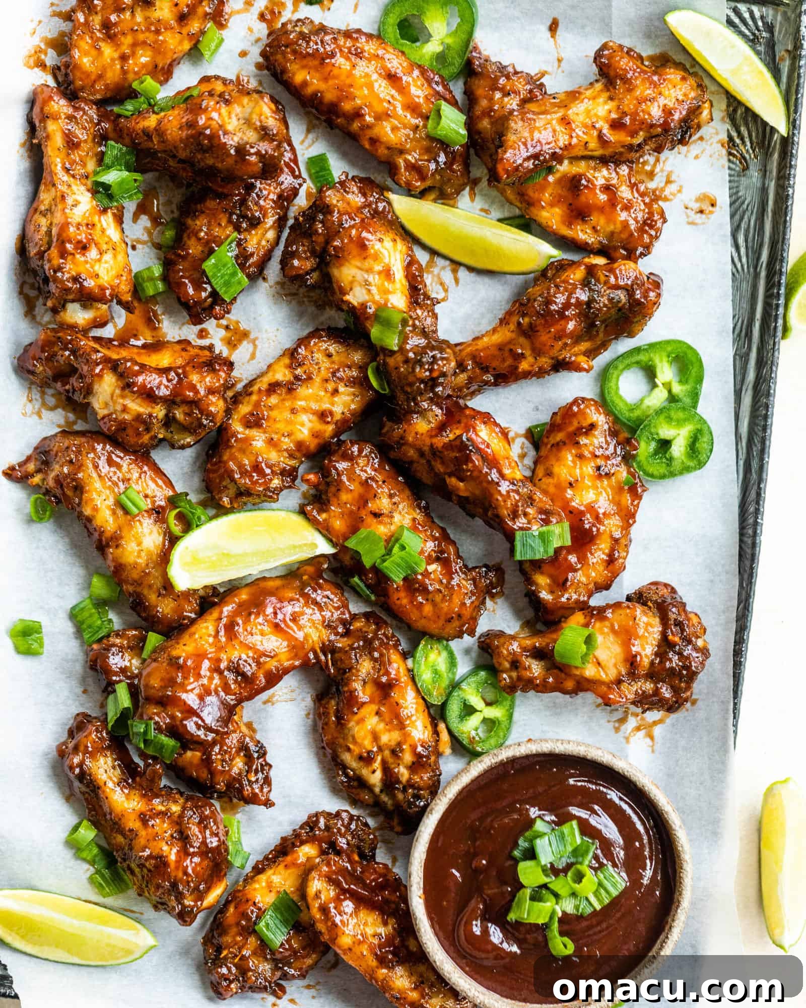 Close-up of seasoned chicken wings before baking, showcasing the dry rub coating.