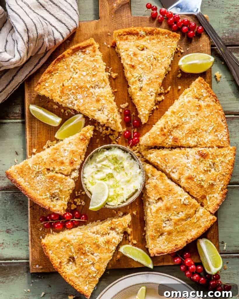 Triangular slices of perfectly golden cornbread, freshly baked and neatly arranged on a rustic wooden serving board, ready to be enjoyed.