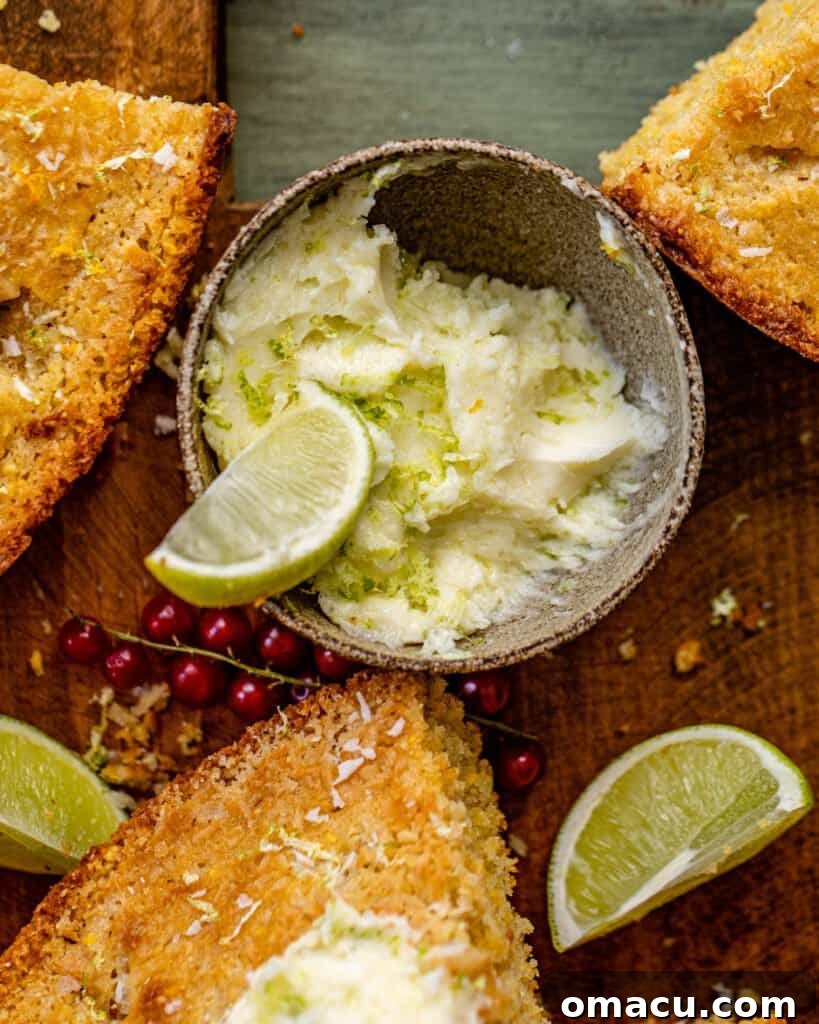 A charming bowl of sweet lime butter positioned gracefully beside perfectly cut slices of fresh coconut cornbread, creating an inviting culinary scene.