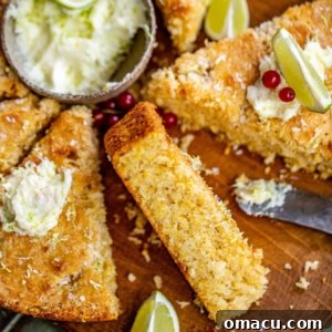 Close-up of sweet lime butter in a small bowl next to slices of freshly baked coconut cornbread, ideal for serving.