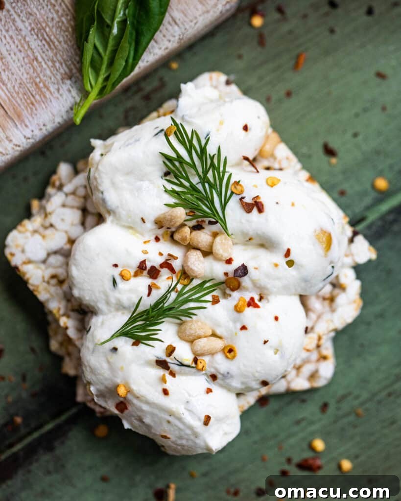 A close-up of labneh in a bowl, ready for serving, highlighting its smooth, creamy texture and inviting appearance.