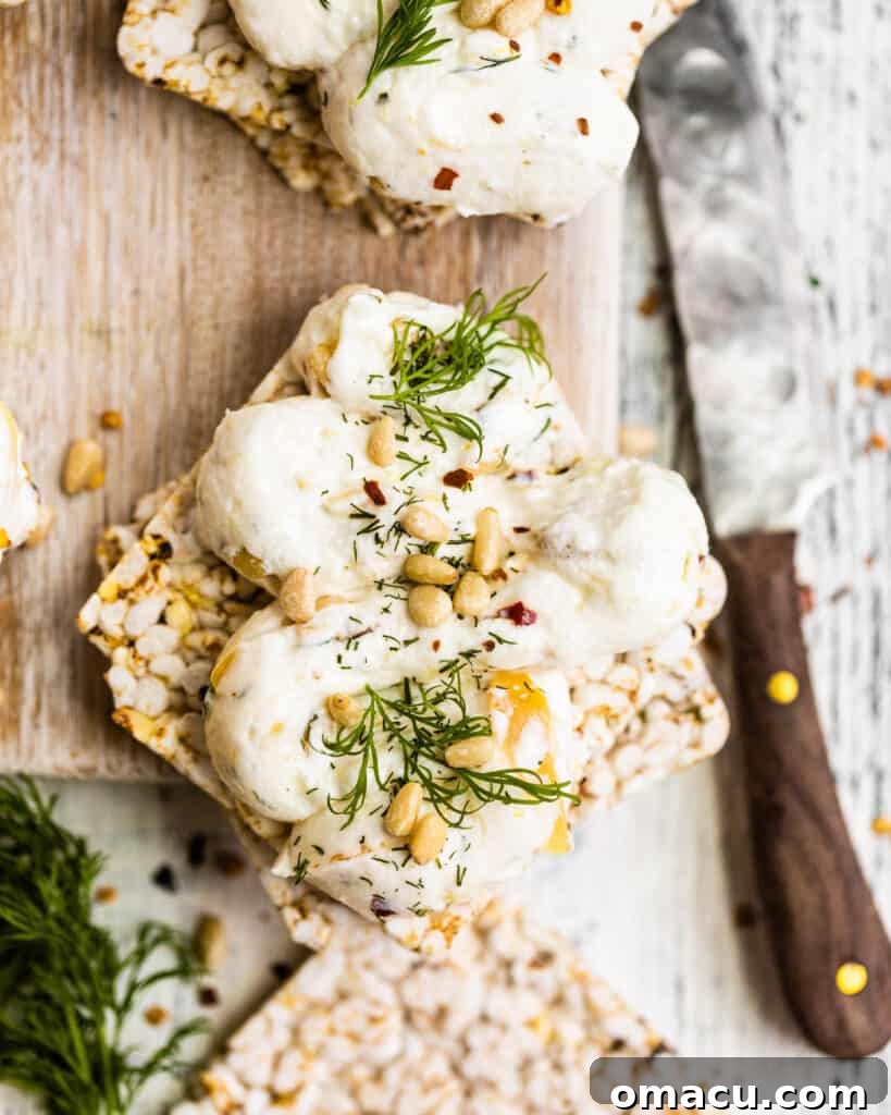 A beautifully presented dish of roasted garlic labneh, ready to be served and savored.