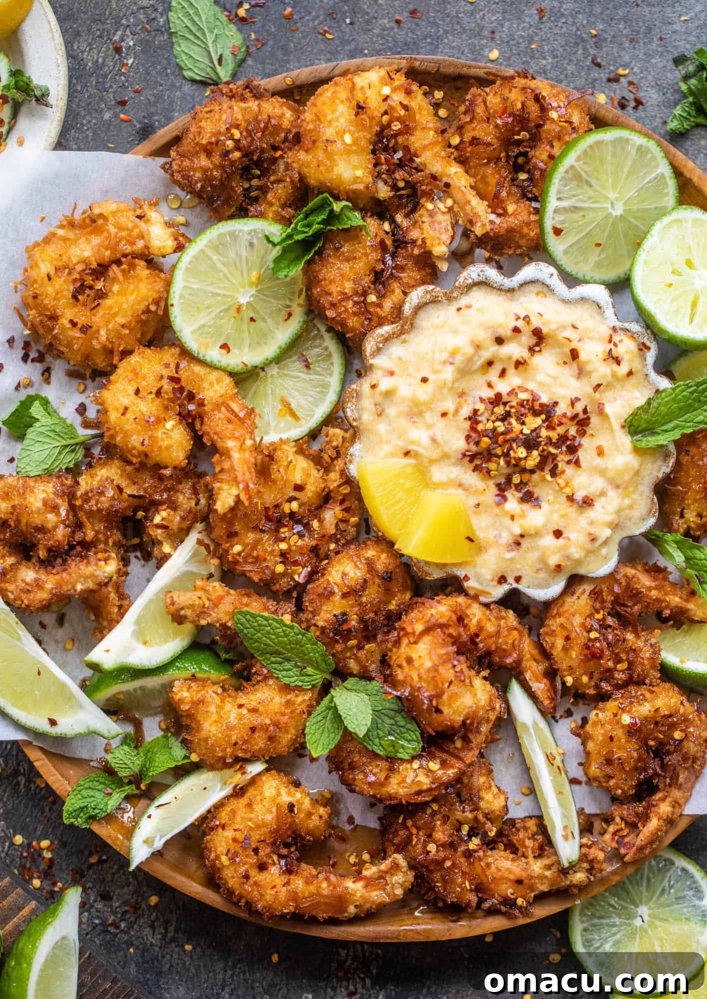 crispy fried shrimp on a plate with dipping sauce