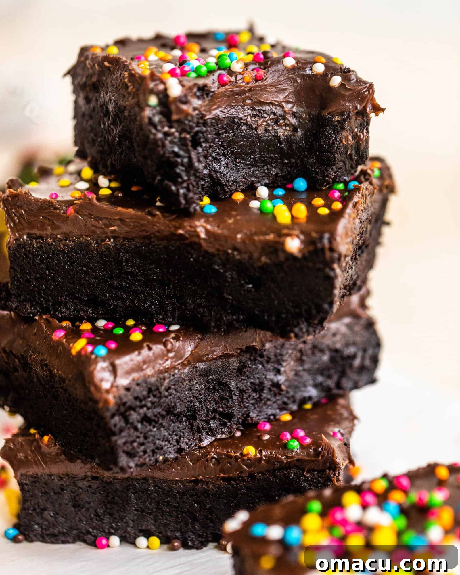 A batch of freshly baked cosmic brownies with their characteristic rainbow sprinkles on top.